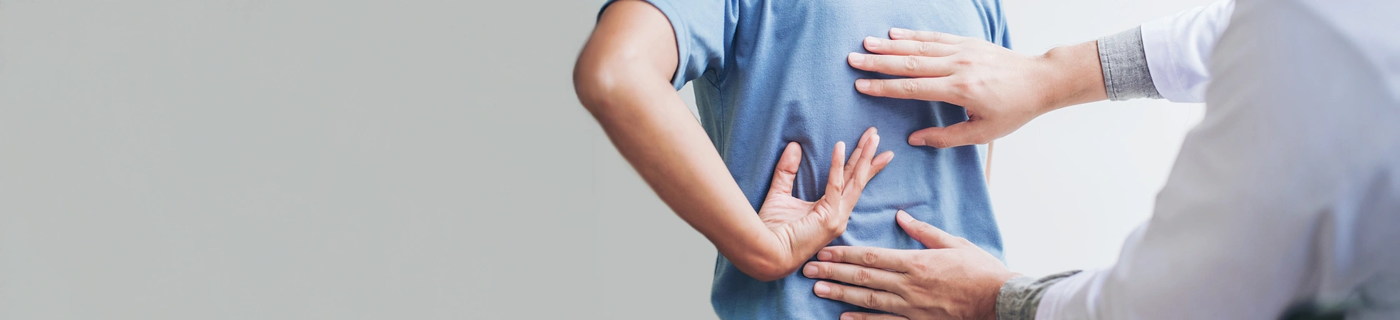Patient consulting a doctor on their back pain
