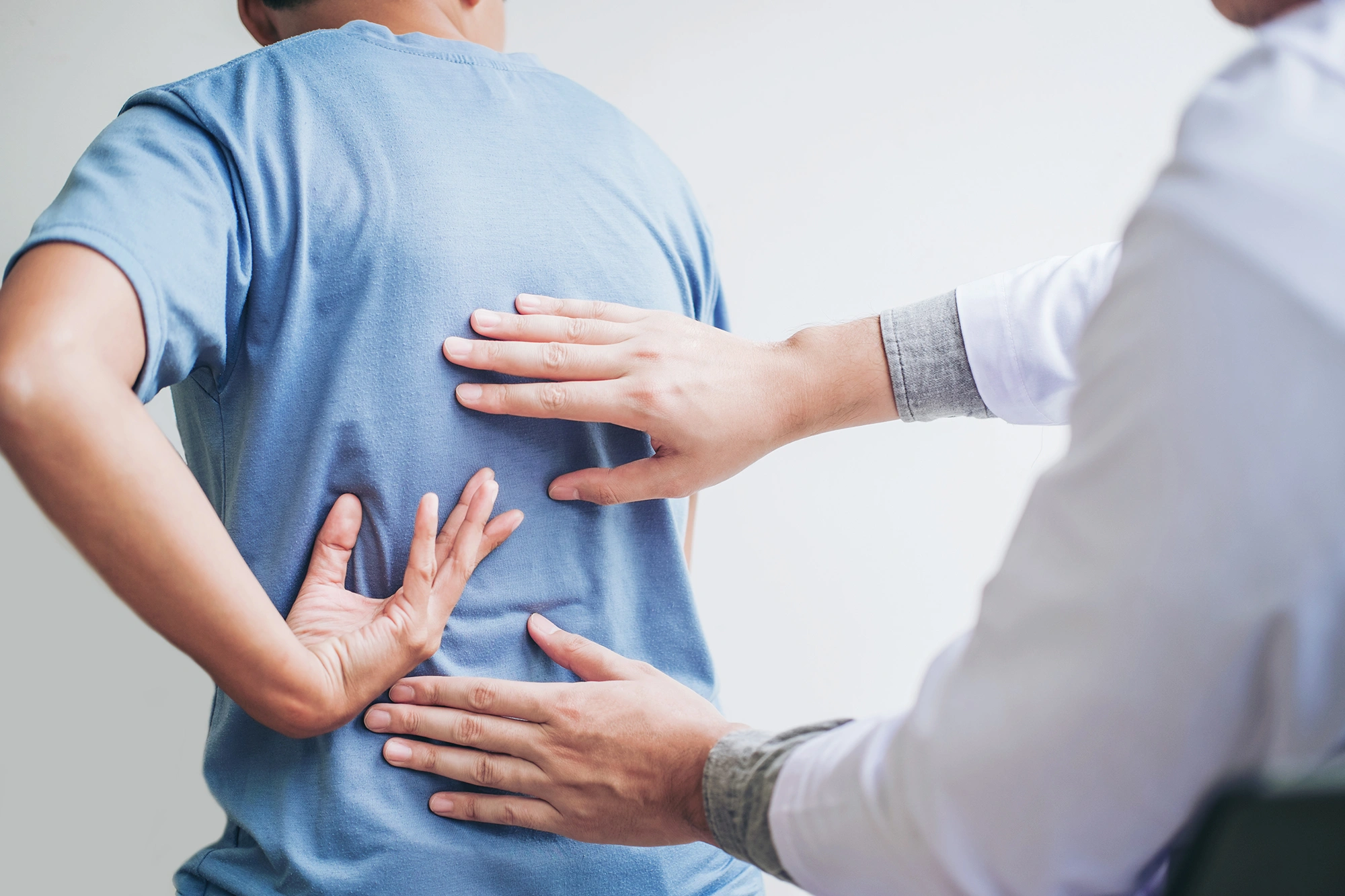 Patient consulting a doctor on their back pain