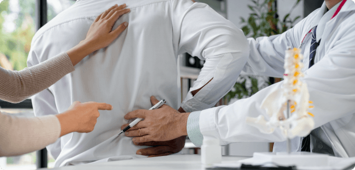 Doctor examining patient with sciatica