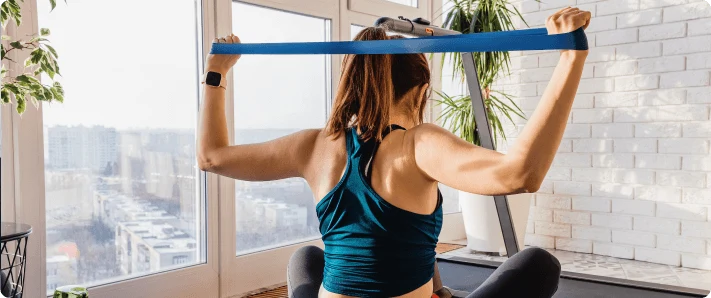 Person practicing good posture for sciatica prevention