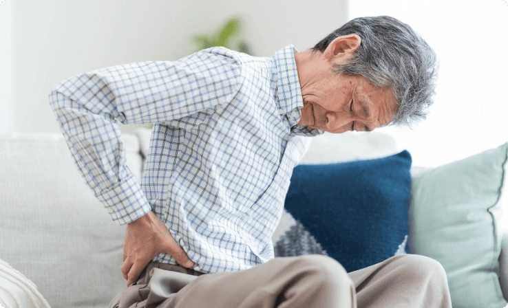 Person with poor posture, a common risk factor for sciatica