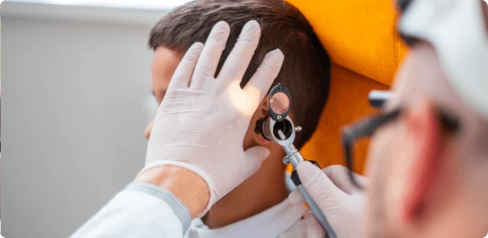 Doctor examining patient with trigeminal-neuralgia