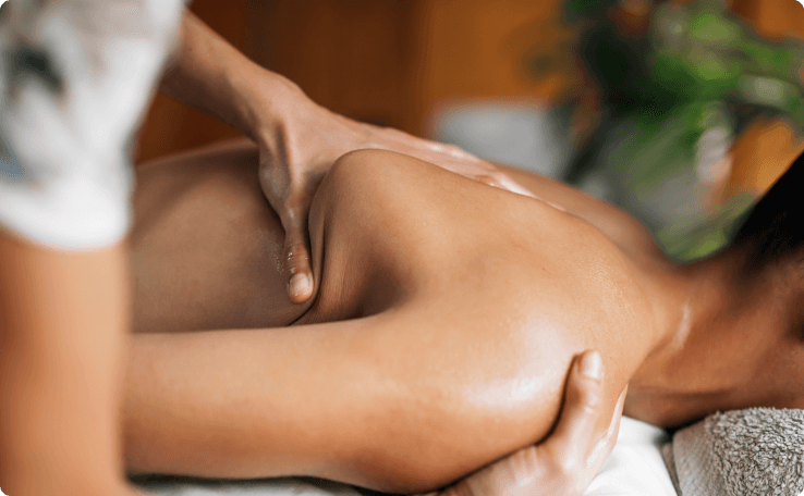 Person demonstrating poor posture at desk, a common risk factor for neck pain